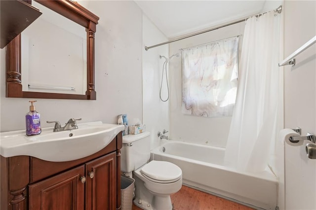 full bathroom with toilet, shower / bath combo with shower curtain, hardwood / wood-style floors, and vanity