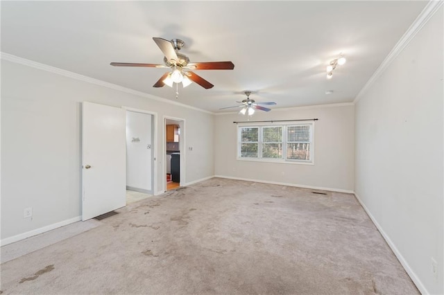 carpeted empty room with ornamental molding and ceiling fan