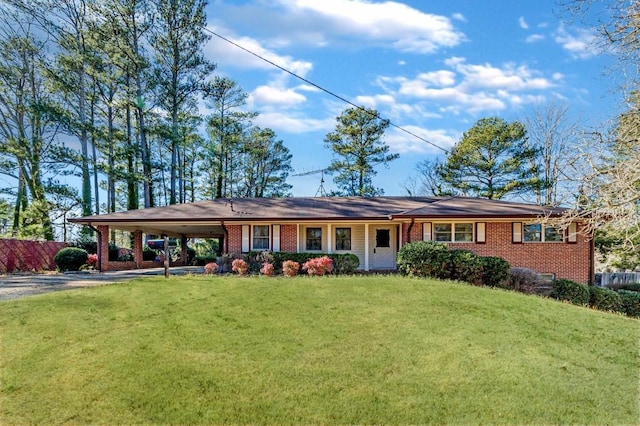 single story home with a carport and a front yard