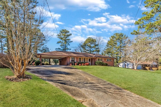 single story home featuring a front yard and a carport