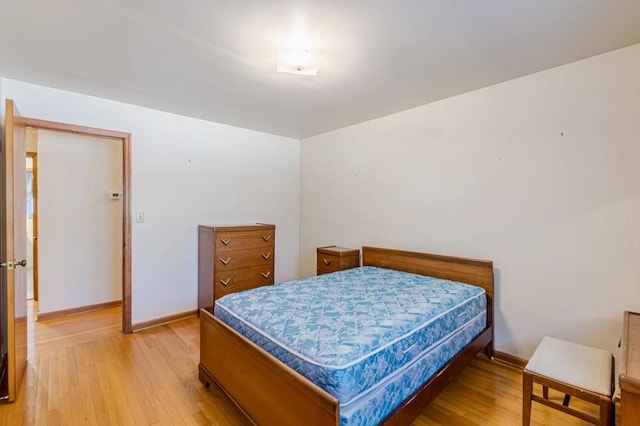 bedroom with wood-type flooring