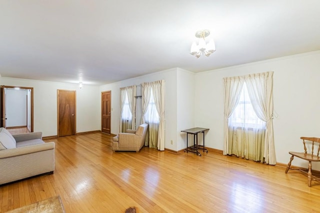 living room featuring hardwood / wood-style flooring and an inviting chandelier