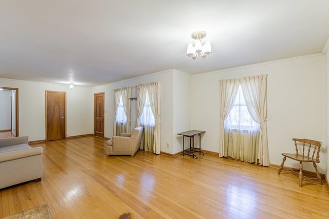 interior space with ornamental molding, wood-type flooring, and a notable chandelier