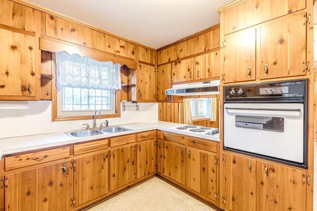 kitchen featuring sink and white appliances