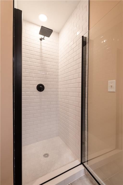 bathroom featuring a shower stall