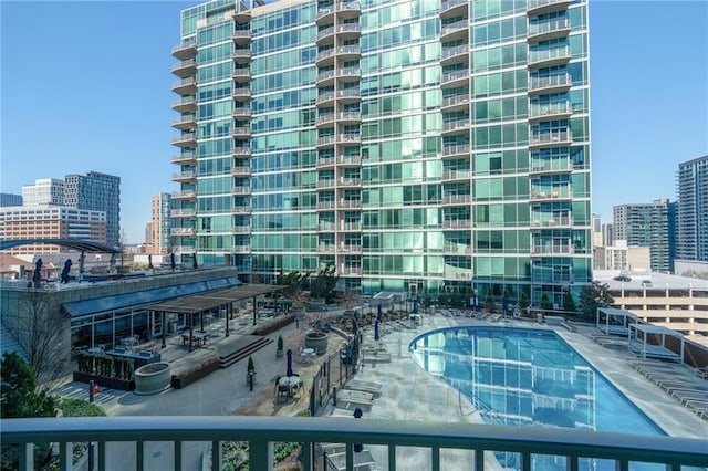 view of swimming pool with a city view