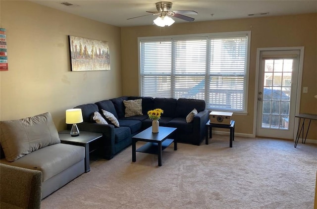 living room with ceiling fan and light colored carpet