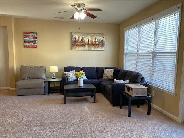 living room with ceiling fan and carpet flooring