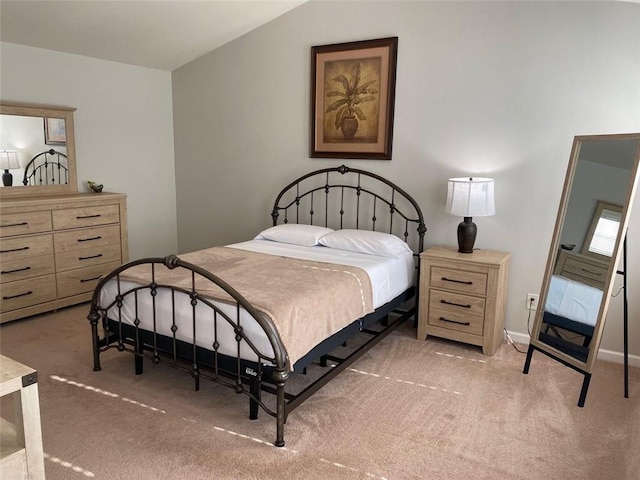 bedroom featuring light carpet