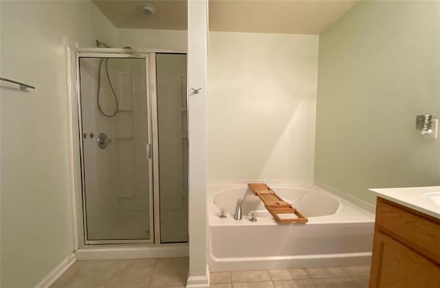 bathroom with vanity, tile patterned floors, and independent shower and bath