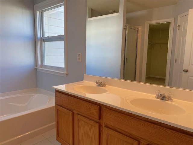 bathroom with vanity, independent shower and bath, and tile patterned floors