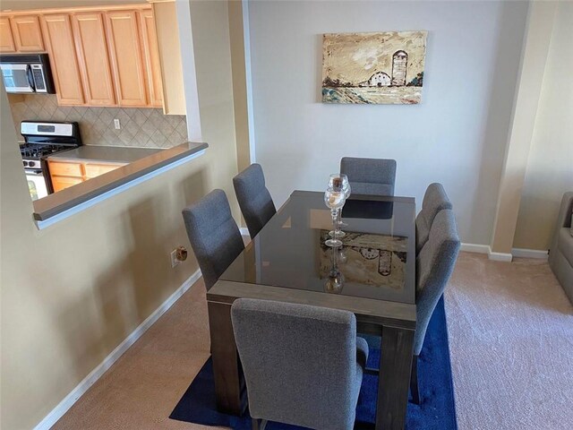 view of carpeted dining area