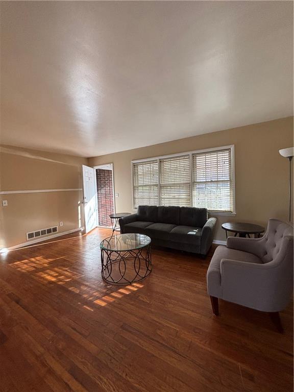 living room with dark hardwood / wood-style floors