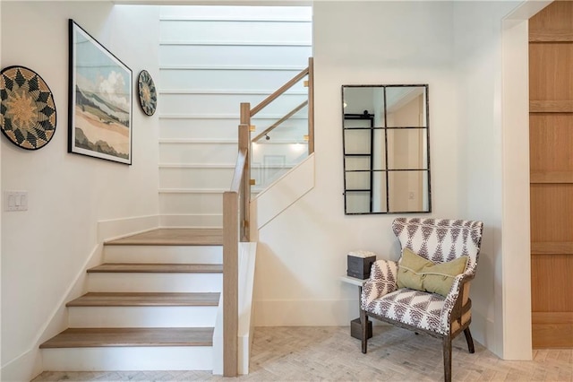 stairs with wood finished floors