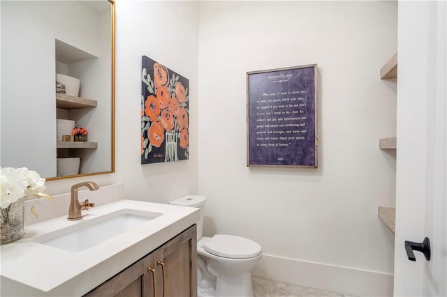 half bath featuring toilet and vanity