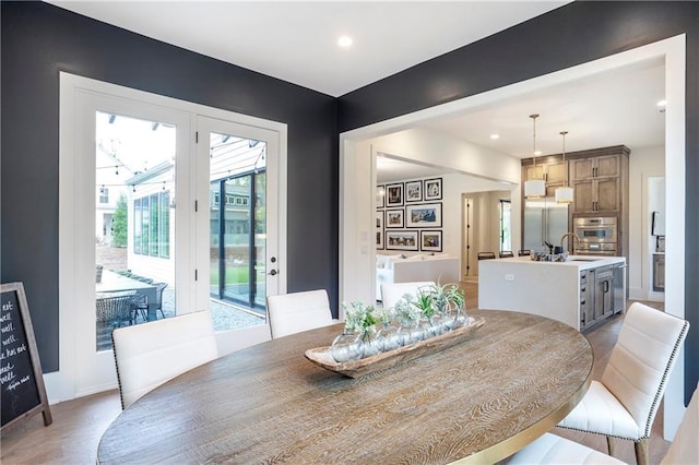 dining space with recessed lighting