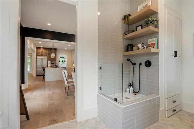 full bath with a walk in shower, recessed lighting, and wood finished floors