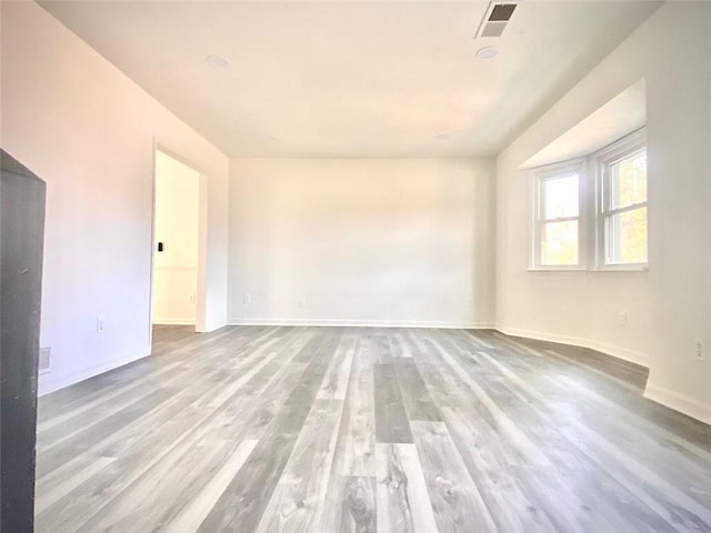 unfurnished room featuring light hardwood / wood-style flooring