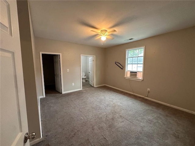 8 Hazel St, Porterdale, GA 30014 - unfurnished bedroom with carpet floors, baseboards, connected bathroom, and ceiling fan