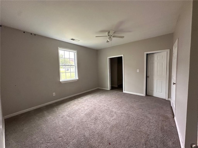 8 Hazel St, Porterdale, GA 30014 - unfurnished bedroom featuring carpet floors, baseboards, and ceiling fan