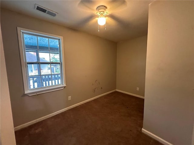 8 Hazel St, Porterdale, GA 30014 - empty room featuring baseboards, ceiling fan, and dark colored carpet