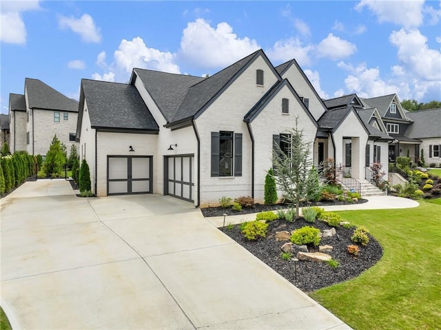 french country inspired facade featuring a front yard and a garage