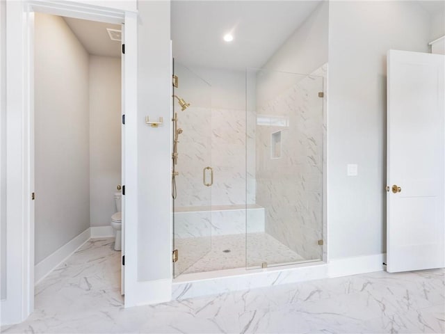 bathroom with walk in shower and toilet