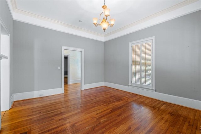 150 E Main St, Rutledge, GA 30663 - spare room featuring a chandelier, ornamental molding, wood-type flooring, and baseboards