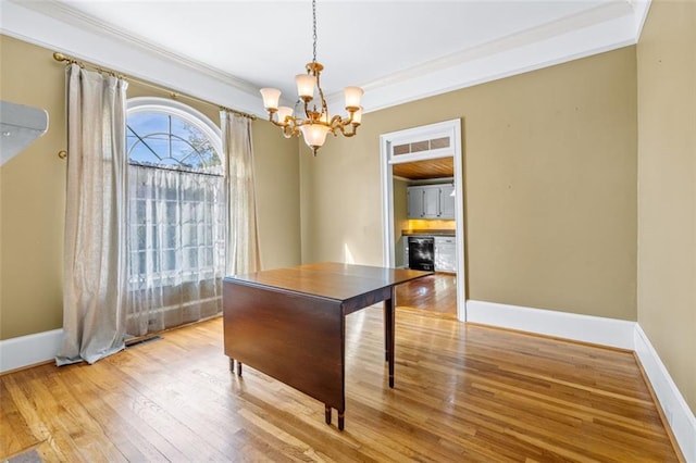 office area with ornamental molding, light hardwood / wood-style flooring, wine cooler, and a chandelier