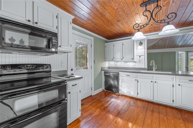 kitchen featuring white cabinets, hanging light fixtures, sink, black appliances, and wooden ceiling