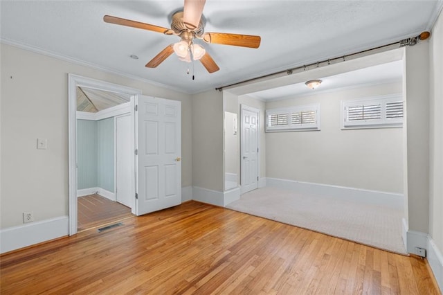 150 E Main St, Rutledge, GA 30663 - spare room with light wood finished floors, a ceiling fan, baseboards, and crown molding