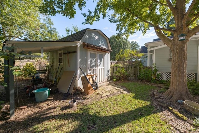 view of outdoor structure featuring a lawn