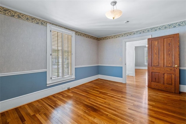 empty room with hardwood / wood-style floors