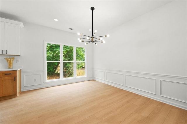 3684 Clearbrooke Way, Duluth, GA 30097 - unfurnished dining area with a chandelier, a decorative wall, light wood-type flooring, wainscoting, and recessed lighting