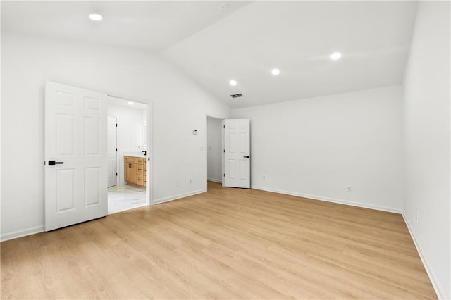 3684 Clearbrooke Way, Duluth, GA 30097 - unfurnished bedroom featuring vaulted ceiling, light wood-type flooring, baseboards, connected bathroom, and recessed lighting