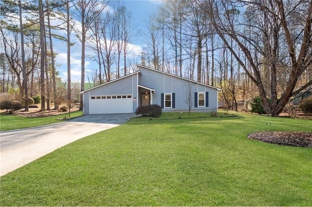 ranch-style home featuring a garage and a front lawn