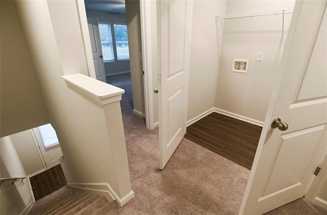 laundry room with hookup for a washing machine, carpet, baseboards, and wood finished floors