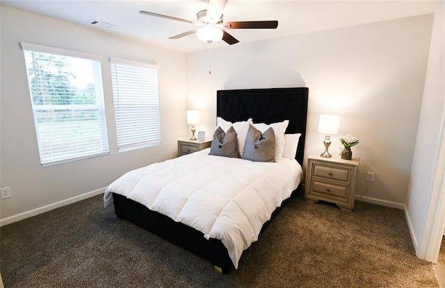 bedroom with carpet floors, baseboards, and visible vents