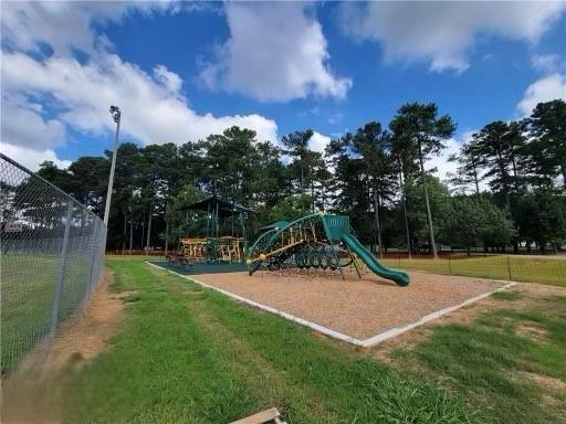 communal playground featuring fence