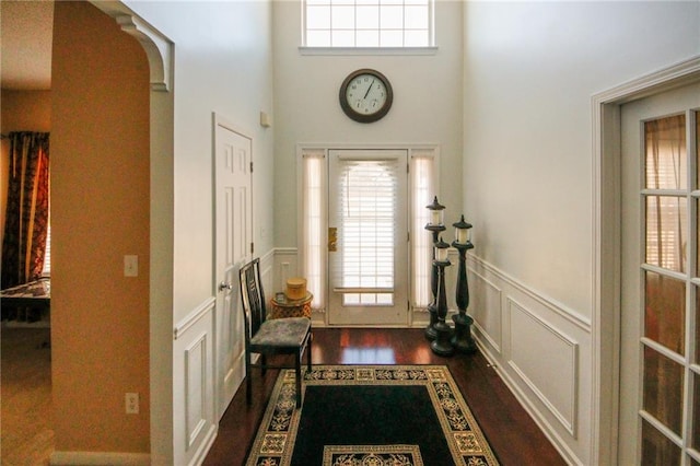 3554 Umatilla Ln SW, South Fulton, GA 30331 - entryway with plenty of natural light, dark wood finished floors, wainscoting, a decorative wall, and a high ceiling