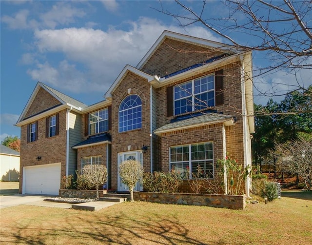 3554 Umatilla Ln SW, South Fulton, GA 30331 - traditional home featuring a garage, brick siding, driveway, and a front lawn