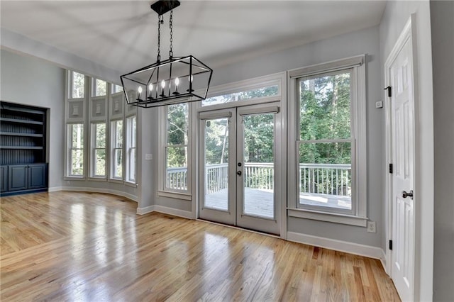 1723 Woodbow Path, Dacula, GA 30019 - unfurnished sunroom with french doors, plenty of natural light, and a chandelier