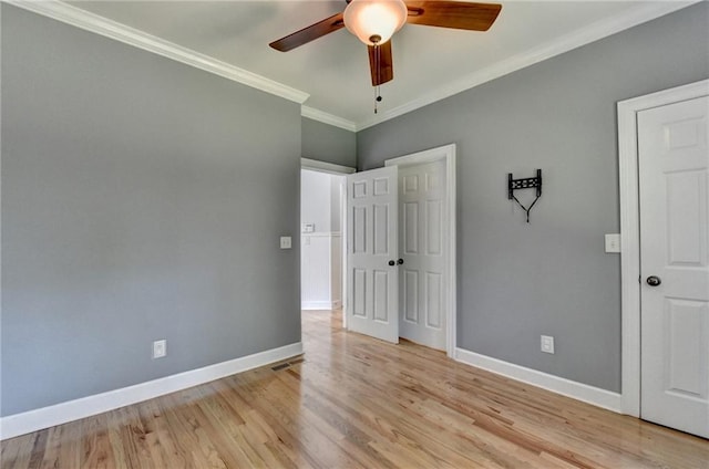 1723 Woodbow Path, Dacula, GA 30019 - unfurnished bedroom with crown molding, light wood-type flooring, and ceiling fan