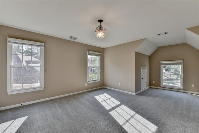 1723 Woodbow Path, Dacula, GA 30019 - carpeted spare room featuring plenty of natural light and vaulted ceiling