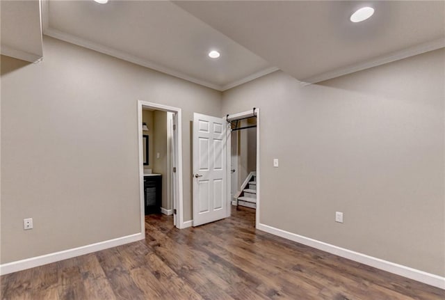 1723 Woodbow Path, Dacula, GA 30019 - unfurnished bedroom featuring ornamental molding, recessed lighting, wood finished floors, and ensuite bath