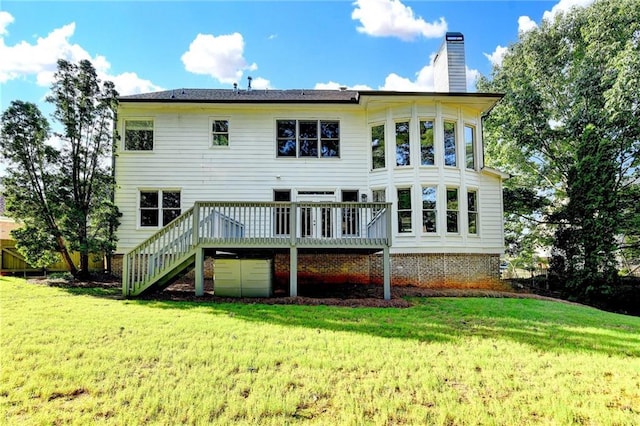 1723 Woodbow Path, Dacula, GA 30019 - rear view of property featuring a deck, a chimney, stairway, and a yard