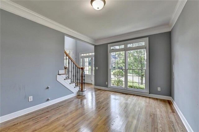 1723 Woodbow Path, Dacula, GA 30019 - entryway with crown molding, stairway, and wood finished floors