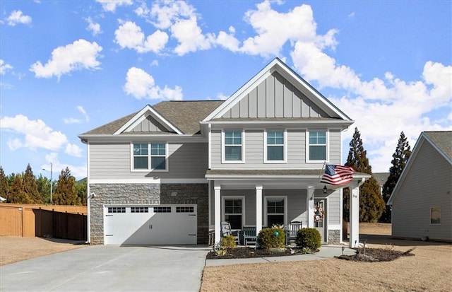 craftsman-style house with a garage and covered porch