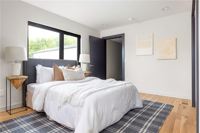 bedroom with wood-type flooring