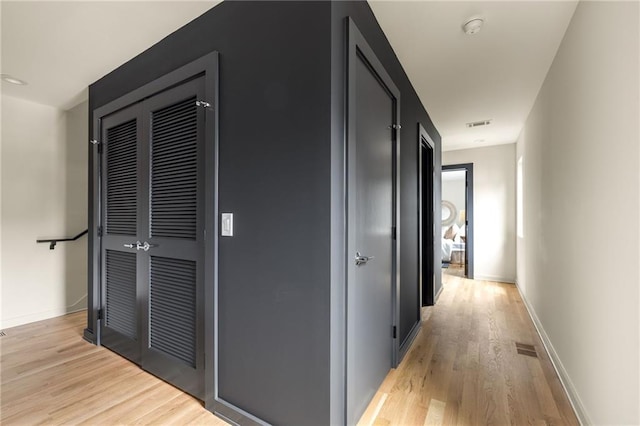 corridor featuring light hardwood / wood-style flooring